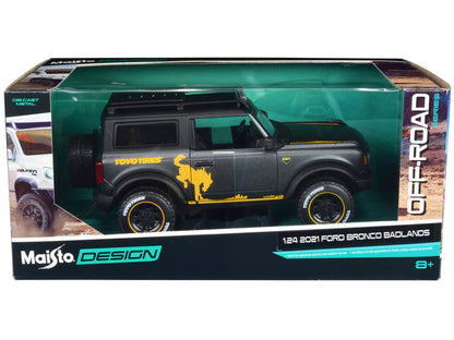 2021 Ford Bronco Badlands Dark Gray Metallic with Gold Graphics and Roof Rack "Off-Road" "Maisto Design" Series 1/24 Diecast Model Car