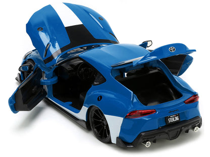 2020 Toyota Supra Blue with Graphics and Max Sterling Diecast Figurine "Robotech" "Hollywood Rides" Series 1/24 Diecast Model Car