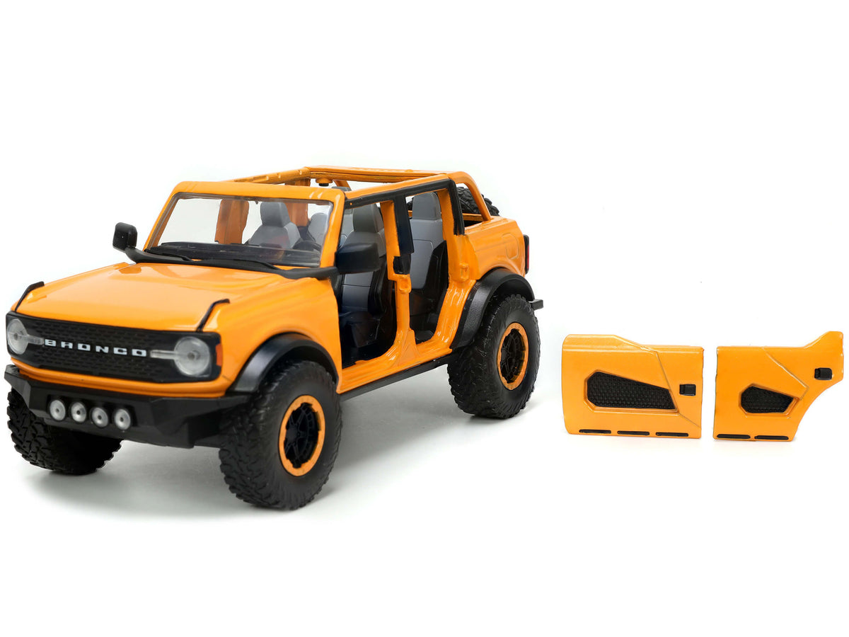 2021 Ford Bronco Orange Metallic with Extra Wheels "Just Trucks" Series 1/24 Diecast Model Car