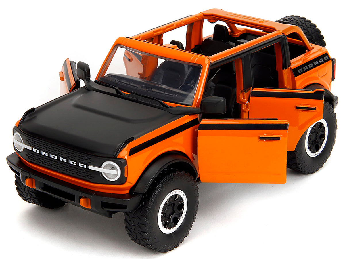 2021 Ford Bronco Open-Top Orange with Black Stripes and Hood with Extra Wheels "Just Trucks" Series 1/24 Diecast Model Car