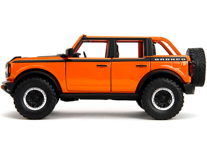 2021 Ford Bronco Open-Top Orange with Black Stripes and Hood with Extra Wheels "Just Trucks" Series 1/24 Diecast Model Car