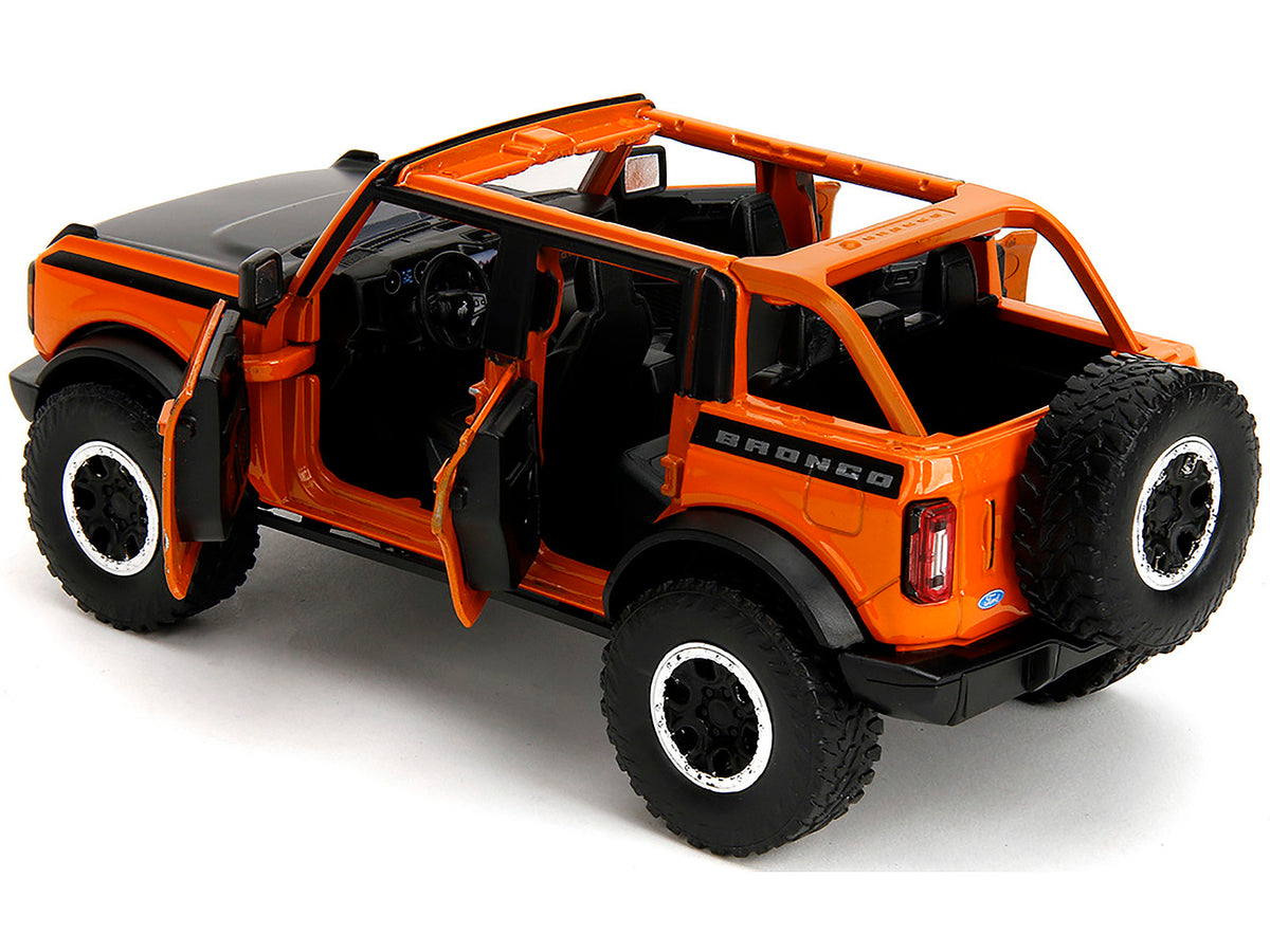 2021 Ford Bronco Open-Top Orange with Black Stripes and Hood with Extra Wheels "Just Trucks" Series 1/24 Diecast Model Car