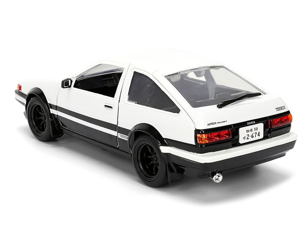 Toyota Trueno (AE86) RHD (Right Hand Drive) White and Black with Graphics and Takumi Diecast Figure "Initial D" (1998-2021) TV Series "Anime Hollywood Rides" Series 1/24 Diecast Model