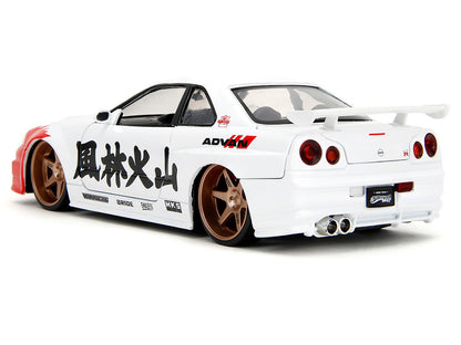 2002 Nissan Skyline GT-R (R34) RHD (Right Hand Drive) White with Red Graphics and Ryu Diecast Figure "Street Fighter" Video Game "Anime Hollywood Rides" Series 1/24 Diecast Model Car