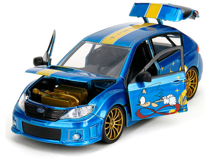 2012 Subaru Impreza WRX STI Blue Metallic with Graphics and Sonic The Hedgehog Diecast Figure "Sonic The Hedgehog" "Hollywood Rides" Series 1/24 Diecast Model Car