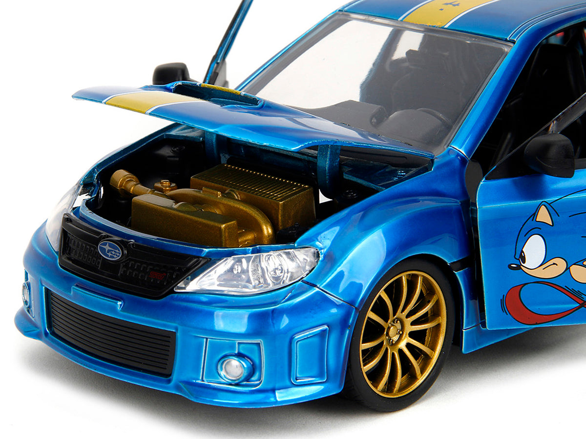2012 Subaru Impreza WRX STI Blue Metallic with Graphics and Sonic The Hedgehog Diecast Figure "Sonic The Hedgehog" "Hollywood Rides" Series 1/24 Diecast Model Car