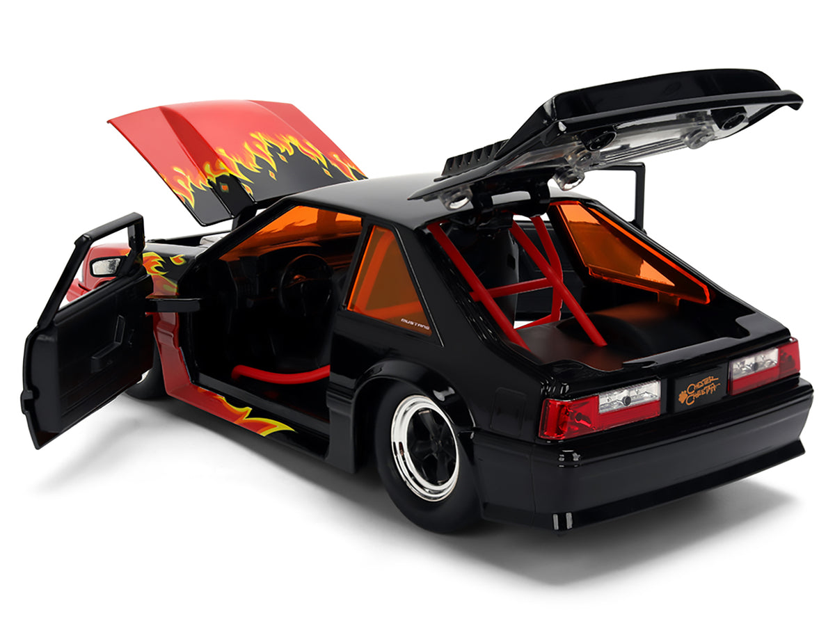 1989 Ford Mustang GT Black with Red Flame Graphics and Chester Cheetah Diecast Figure "Cheetos Flamin' Hot" "Hollywood Rides" Series 1/24 Diecast Model Car
