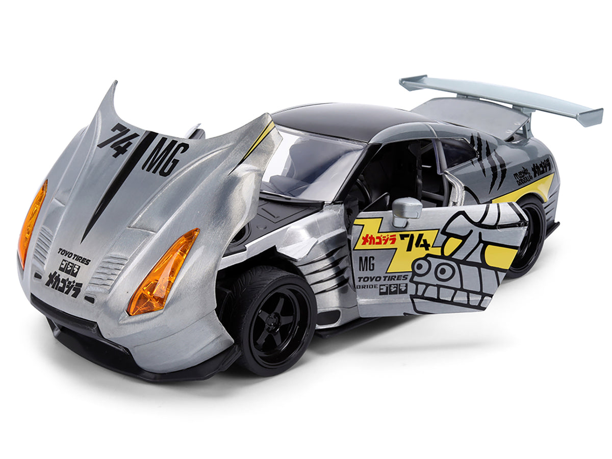 2009 Nissan GT-R (R35) Ben Sopra Brushed Metal with Black Top and Graphics and Mechagodzilla Diecast Figure "Godzilla" Franchise "Anime Hollywood Rides" Series 1/24 Diecast Model