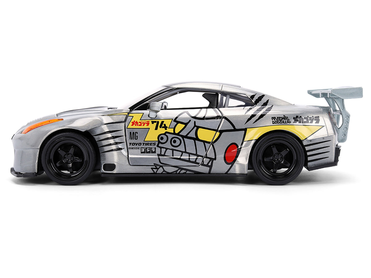 2009 Nissan GT-R (R35) Ben Sopra Brushed Metal with Black Top and Graphics and Mechagodzilla Diecast Figure "Godzilla" Franchise "Anime Hollywood Rides" Series 1/24 Diecast Model