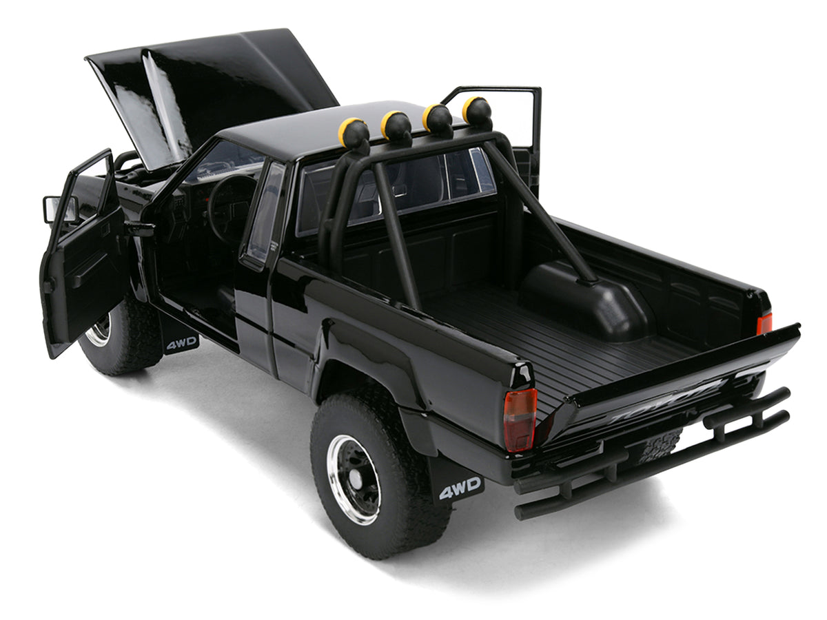 1985 Toyota SR5 Pickup Truck Black with Marty's Skateboard "Back to the Future" (1985) Movie "Hollywood Rides" Series 1/24 Diecast Model Car