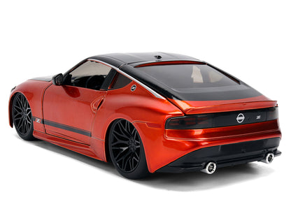 2023 Nissan Z Orange Metallic with Carbon Hood and Black Top "JDM Tuners" Series 1/24 Diecast Model Car