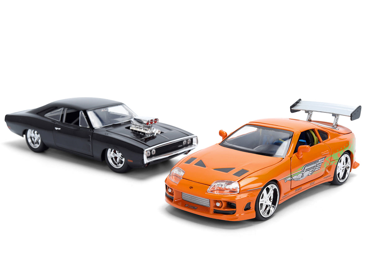 Dom's 1970 Dodge Charger R/T Black and Brian's Toyota Supra Orange with Graphics Set of 2 Cars "Fast & Furious 25th Anniversary" "Fast & Furious" Series 1/24 Diecast Model Cars