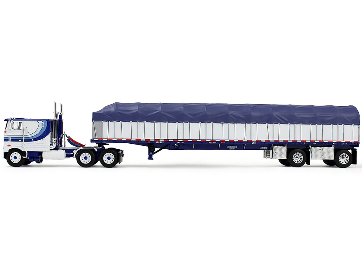 Peterbilt 352 COE 110" Sleeper and 53’ Wilson Roadbrute Flatbed Trailer with Covered Wagon White with Blue Stripes 1/64 Diecast Model