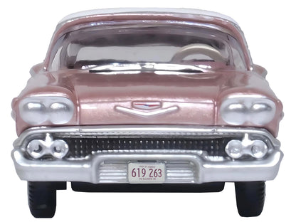 1958 Chevrolet Impala Sport Cay Coral Pink Metallic with White Top 1/87 (HO) Scale Diecast Model Car