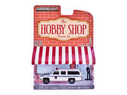 1985 GMC Suburban 2500 "New York City Transit Police Department" White with Blue Stripes and Police Officer Figure "The Hobby Shop" Series 16 1/64 Diecast Model Car