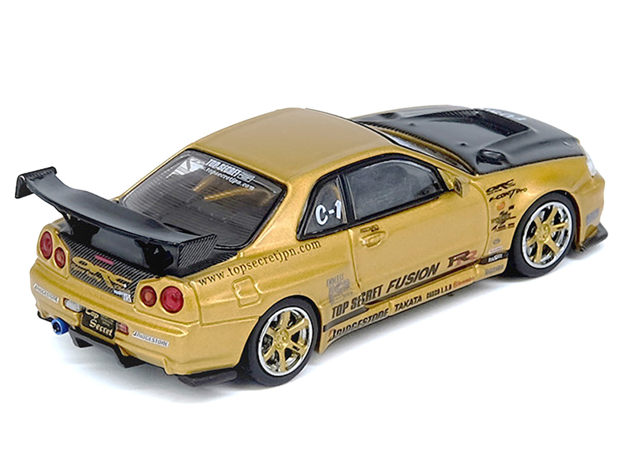 Nissan Skyline GT-R (R34) RHD (Right Hand Drive) "Top Secret" Gold Metallic with Carbon Hood and Trunk 1/64 Diecast Model Car