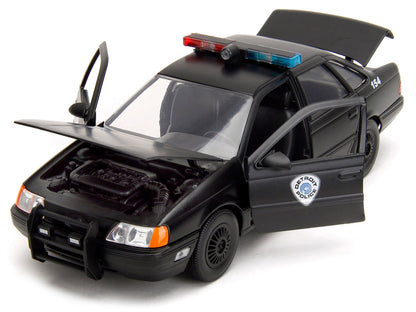 Ford Taurus OCP Matt Black "Detroit Police" and Robocop Diecast Figure 35th Anniversary "Robocop" (1987) Movie "Hollywood Rides" Series 1/24 Diecast Model Car